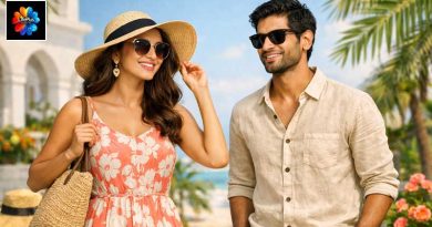 Indian man and woman in trendy summer outfits — sleeveless floral dress and linen shirt — standing outdoors under bright sunlight with tropical background, representing summer fashion in India.